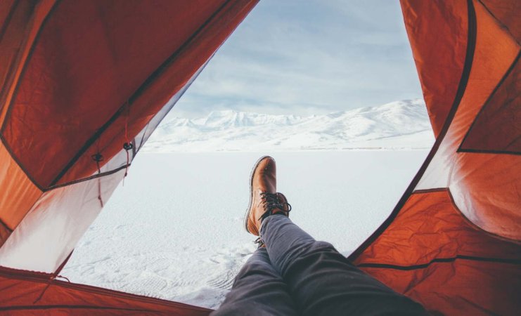 Person camping in the snow